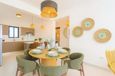 a dining room with a table and chairs at Elegant Cocotal 2BD Condo in Punta Cana