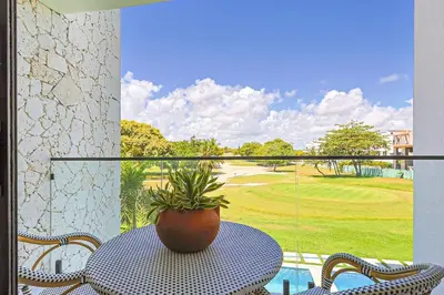 a potted plant sitting on a table on a balcony at Elegant Cocotal 2BD Condo in Punta Cana