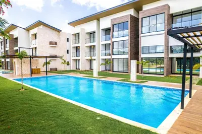 an image of a swimming pool in front of a building at Elegant Cocotal 2BD Condo in Punta Cana
