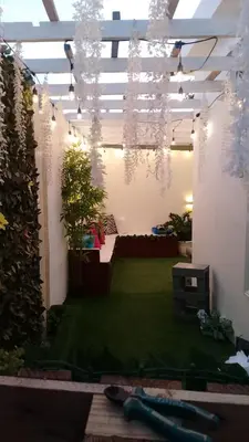 a room with a garden with plants and lights at Remanso de Paz in Pedernales