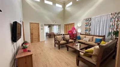 a living room with a couch and a table at Villa Enma RD in Nizao