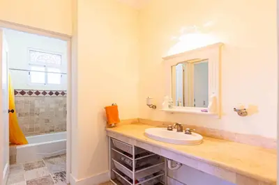 a bathroom with a sink and a mirror at Ocean front, direct access to the beach in Cabarete