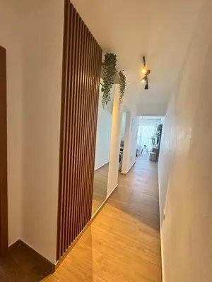 a hallway with a large mirror in a room at Cozy Apt Steps from Los Corales Beach in Punta Cana