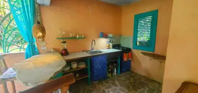 a small kitchen with a sink and a window at Studio surrounded by nature in Cabarete
