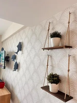 a wall with two shelves with plants on it at Your oceanfront paradise in La Puntica de Juan Dolio