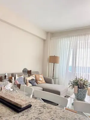 a living room with a couch and a table at Your oceanfront paradise in La Puntica de Juan Dolio