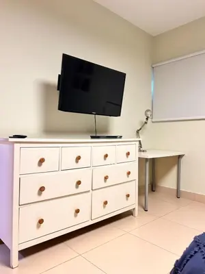 a white dresser with a flat screen tv on top at Your oceanfront paradise in La Puntica de Juan Dolio
