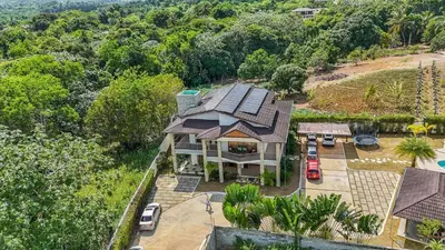 an aerial view of a house with a lot of trees at La Vega Villa with Private Pool and BBQ in Concepción de La Vega