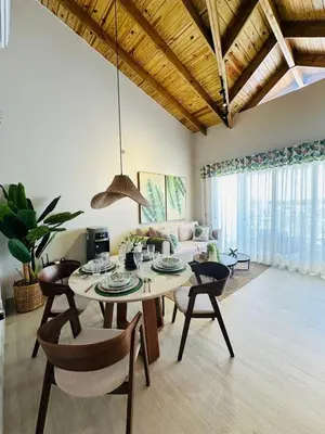 a living room with a table and a couch at IBE 402 Penthouse with Pool Garden Breeze Dominicus in La Laguna