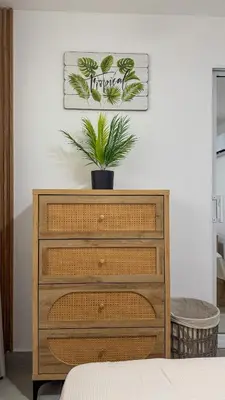 a bedroom with a dresser with a plant on it at Stay Caribbean Bayahibe Getaway in Bayahibe