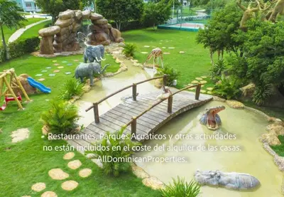 a water park with a waterfall and a playground at Sosua Ocean Village, Villas 24 in Sosúa