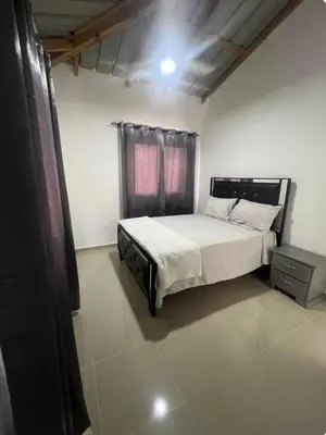 a bedroom with a large bed and a window at Apartamento Luna Llena in Colorado