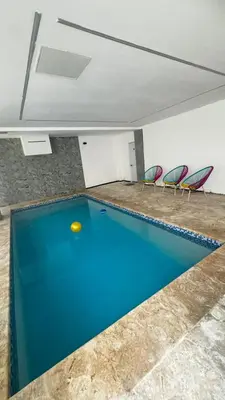 a pool table in a room with chairs at Estancia Rincon del AMOR in Juan López