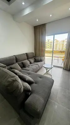 a living room with a couch and a table at Estancia Rincon del AMOR in Juan López