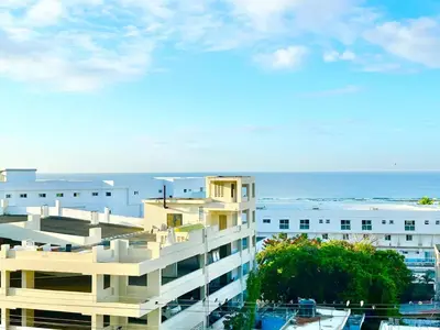 a view of a building with the ocean in the background at Ocean Views Escape at DGM Resort in Boca Chica