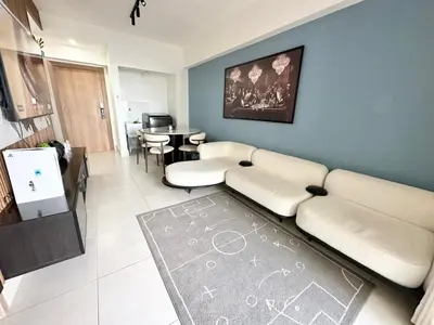 a living room with a couch and a table at Ocean Views Escape at DGM Resort in Boca Chica