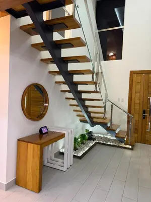 a staircase with a wooden bench and a mirror at New villa with 4 bedrooms and 5 beds in La Romana