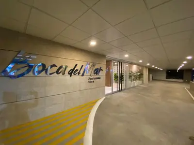 a building with a sign on the side of a wall at Boca del Mar Tower III Apart 401 in Boca Chica