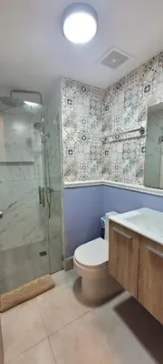 a bathroom with a shower and a toilet and a sink at Boca del Mar Tower III Apart 401 in Boca Chica