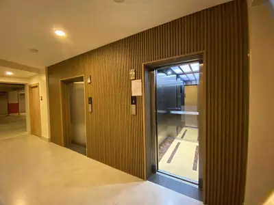 a hallway with a glass door in a building at Boca del Mar Tower III Apart 401 in Boca Chica