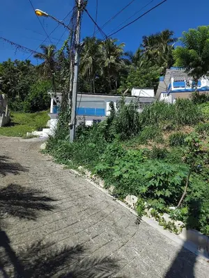 an empty road in front of a house at Villa de Angela en Samana in Sabana