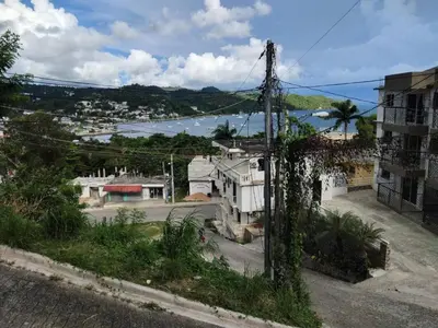 a view of a town with a river and buildings at Villa de Angela en Samana in Sabana