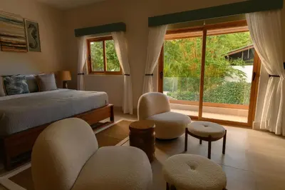 a bedroom with a bed and a large window at New! Gorgeous Portillo Beach Villa W Pool & Staff in Abra Grande