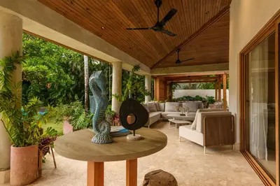 a living room with a couch and a table at New! Gorgeous Portillo Beach Villa W Pool & Staff in Abra Grande