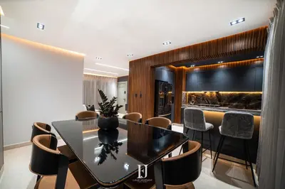 a dining room with a table and chairs at Fj Luxury Apartment in Santiago de los Caballeros