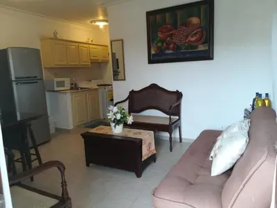 a living room with a couch and a coffee table at Estancia Marina 101 in Boca Chica