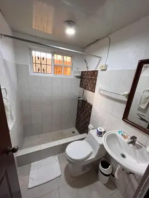 a bathroom with a toilet and a sink at Estancia Marina 101 in Boca Chica