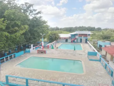 an image of a swimming pool at a resort at Villa club turístico tu ancla in Los Alcarrizos