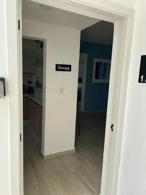 a door to a kitchen with a sign on it at Swim up and Beach Getaway at White Sands in Punta Cana