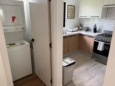 a kitchen with a sink and a stove at Swim up and Beach Getaway at White Sands in Punta Cana