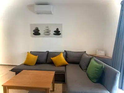 a living room with a couch and a table at Modern apartament near the sea-Las Terrenas in Las Terrenas