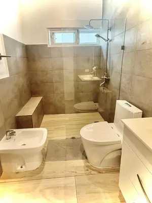 a bathroom with a toilet and a sink at Modern apartament near the sea-Las Terrenas in Las Terrenas