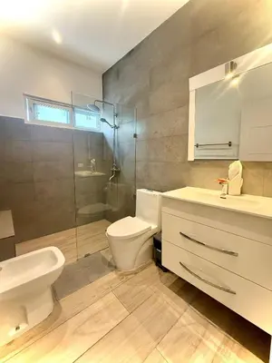 a bathroom with a toilet and a sink and a shower at Modern apartament near the sea-Las Terrenas in Las Terrenas