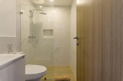 a bathroom with a shower with a toilet and a sink at PB 3 hab | con piscina privada + laguna cristalina in Punta Cana