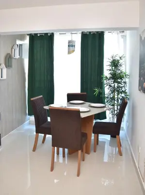 a dining room with a table and chairs at Luxury Pool Gym Basketball in Santiago de los Caballeros