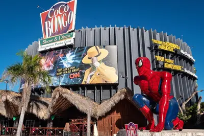 a building with a spider man statue in front of it at Cana Rock Penthouse Golf Views & Infinity Pool in Punta Cana