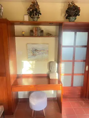 a wooden desk in a room with a chair at Lux 2-Level Townhouse with Stunning Historic Views in Santo Domingo