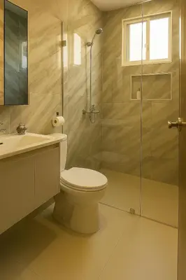 a bathroom with a toilet and a glass shower at Comfortable and Attractive Apartment in Ensanche Savica de Mendoza