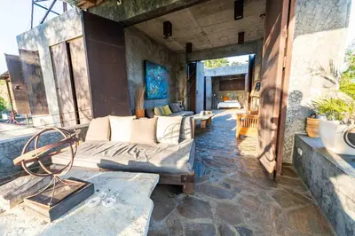a living room with a couch and a chair at House Cottage in Caribbean Mountains 2
