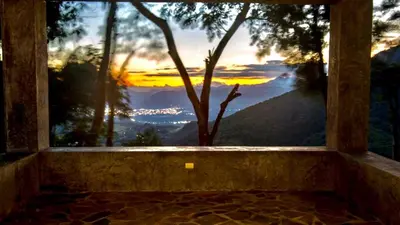 a window with a view of a mountain view at House Cottage in Caribbean Mountains 2