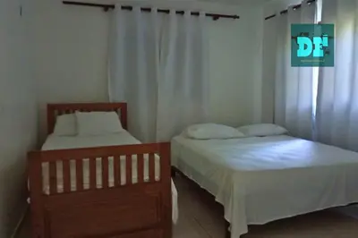 two beds sitting next to each other in a bedroom at Villa Eli in Puerto Plata