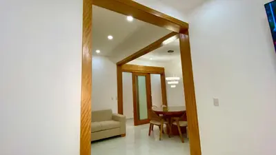 a hallway with a couch and a table in a room at Zarzuela Villas del Mar Puerto Plata in Muñoz