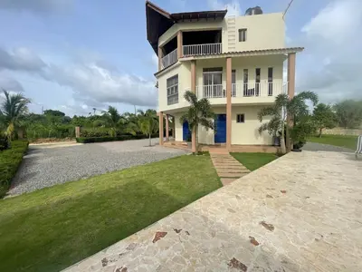 a large white house with a large driveway at Jeda Village in Higuey