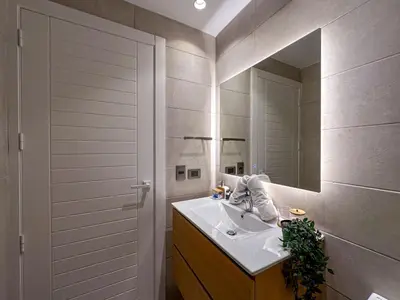 a bathroom with a sink and a mirror at Beautiful brand new Beach Condo w Picuzzi in Punta Cana
