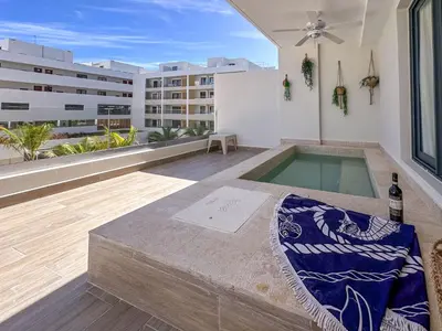 a swimming pool in the middle of a building at Beautiful brand new Beach Condo w Picuzzi in Punta Cana