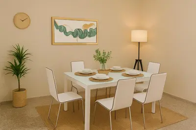a dining room with a white table and chairs at Bright & Spacious En-suite Room - Santo Domingo Este in Cancino